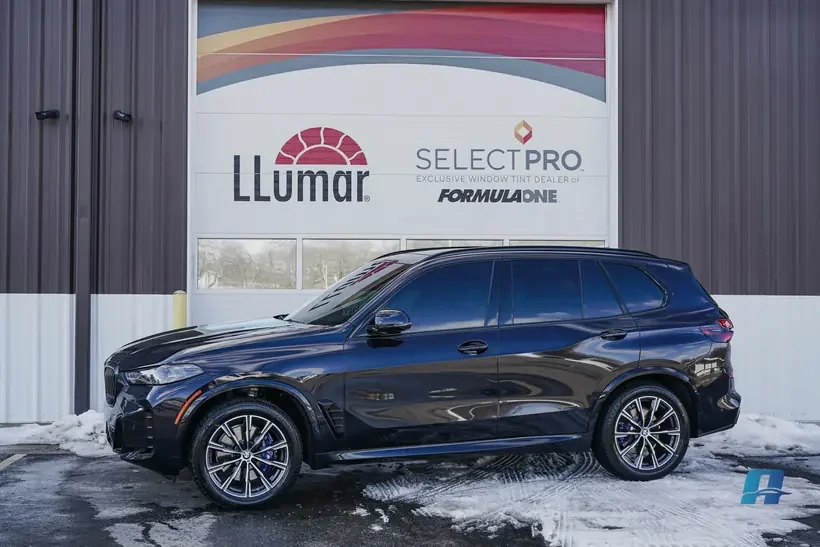 Blue BMW X5 outside the Auto Obsessions LLumar SelectPro bay after paint protection film